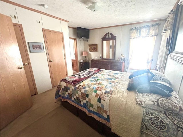 171 E 5th St, Schell City, MO 64783 - carpeted bedroom featuring crown molding and a textured ceiling