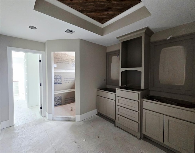 2615 SW Firefly Ln, Lees Summit, MO 64082 - kitchen featuring a tray ceiling and baseboards