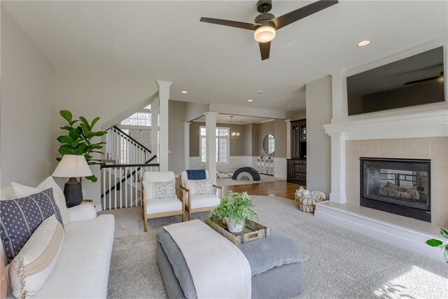 9500 N Lane Ave, Kansas City, MO 64157 - living room featuring a ceiling fan, a fireplace, stairway, carpet, and recessed lighting