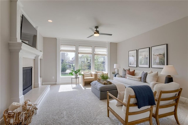 9500 N Lane Ave, Kansas City, MO 64157 - living room featuring a fireplace, baseboards, ceiling fan, light colored carpet, and recessed lighting