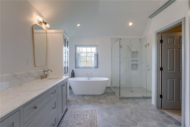 9500 N Lane Ave, Kansas City, MO 64157 - bathroom featuring vanity, a marble finish shower, vaulted ceiling, and a soaking tub