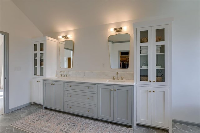 9500 N Lane Ave, Kansas City, MO 64157 - full bathroom with double vanity, a sink, and lofted ceiling