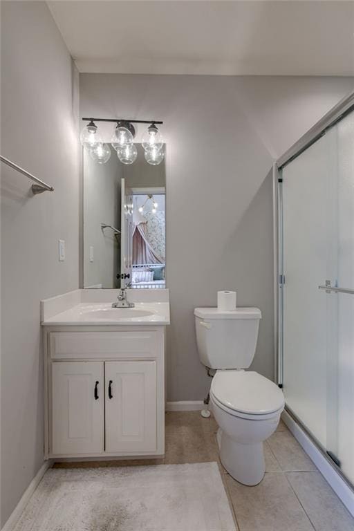 9500 N Lane Ave, Kansas City, MO 64157 - bathroom with vanity, toilet, baseboards, tile patterned floors, and a stall shower