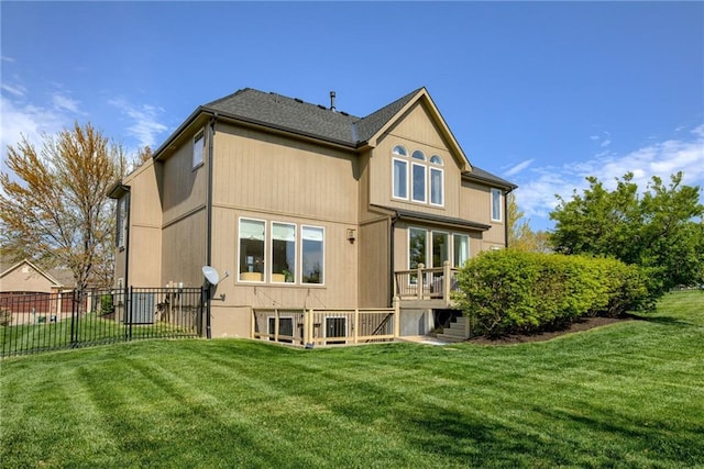 9500 N Lane Ave, Kansas City, MO 64157 - rear view of house featuring fence, stairs, a wooden deck, and a lawn