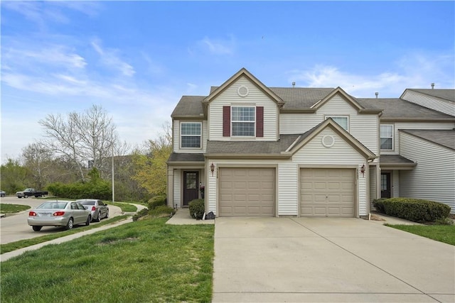 view of front of home with a garage, driveway, a shingled roof, and a front lawn
