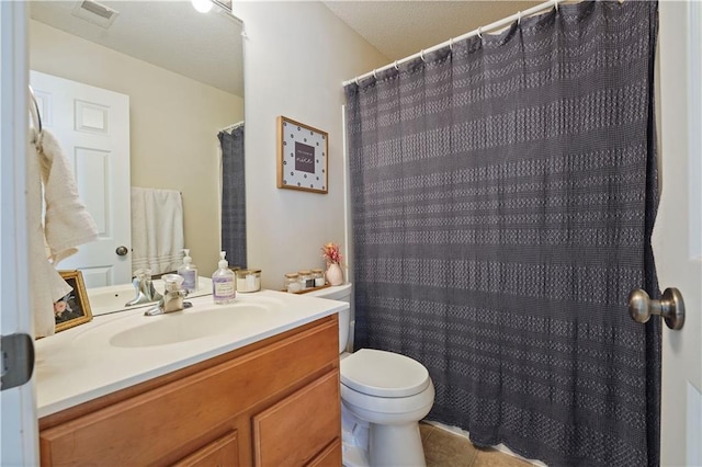 full bathroom with toilet, visible vents, curtained shower, tile patterned flooring, and vanity