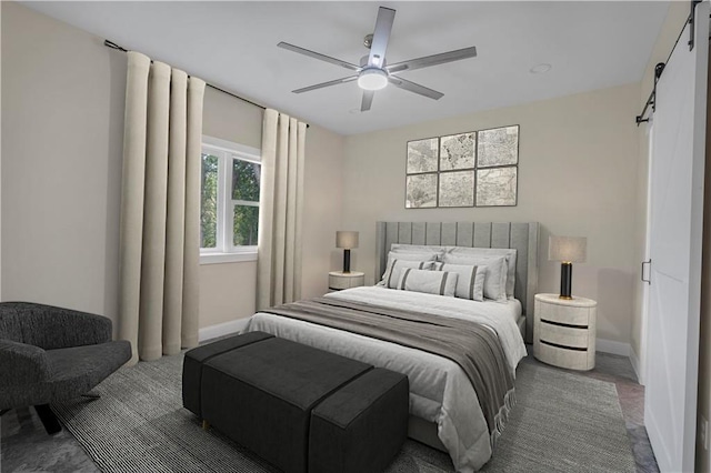 bedroom featuring a barn door, baseboards, and ceiling fan