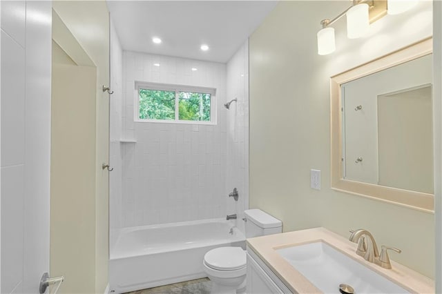 bathroom with toilet, vanity, and shower / bath combination
