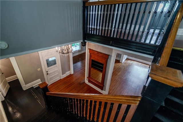 603 N 5th St, Atchison, KS 66002 - stairs with a chandelier and wood finished floors