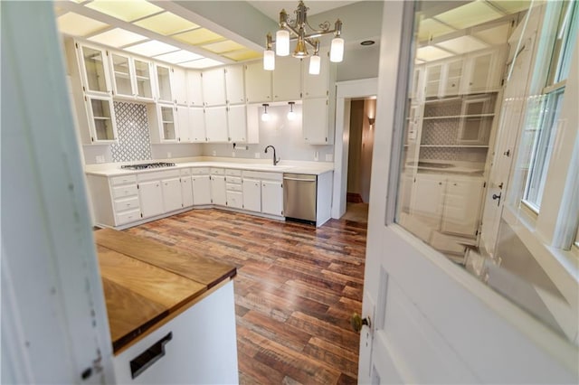 603 N 5th St, Atchison, KS 66002 - kitchen with dishwasher, a sink, dark wood-style flooring, white cabinetry, and light countertops