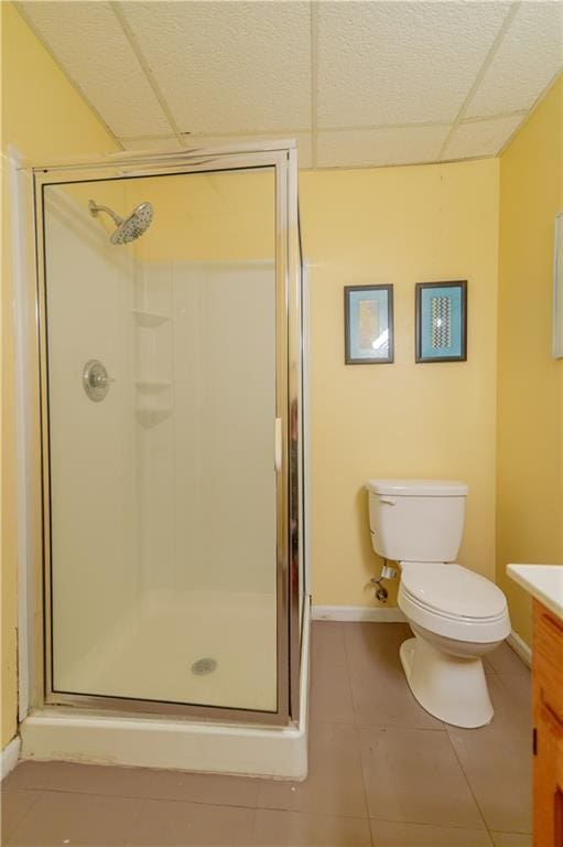 603 N 5th St, Atchison, KS 66002 - bathroom featuring vanity, tile patterned flooring, a shower stall, toilet, and baseboards