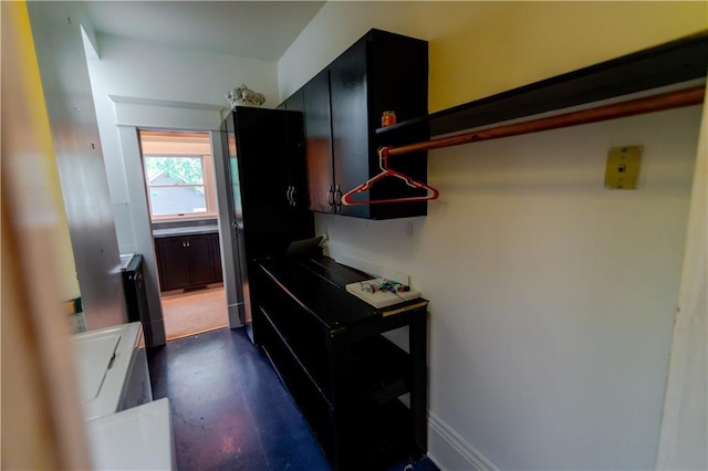 603 N 5th St, Atchison, KS 66002 - kitchen with finished concrete flooring and dark cabinetry