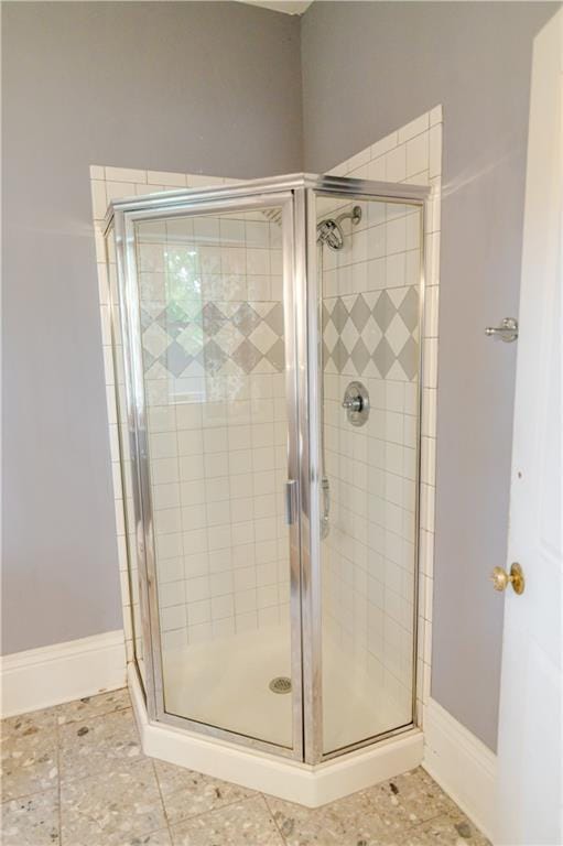 603 N 5th St, Atchison, KS 66002 - full bathroom featuring a shower stall and baseboards