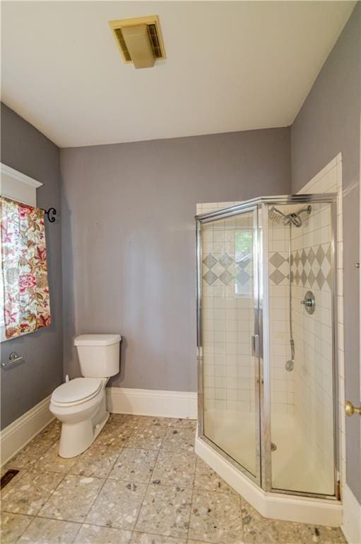 603 N 5th St, Atchison, KS 66002 - full bathroom with toilet, a shower stall, baseboards, and healthy amount of natural light