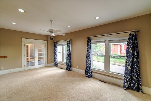 603 N 5th St, Atchison, KS 66002 - spare room with french doors, carpet flooring, baseboards, recessed lighting, and a ceiling fan