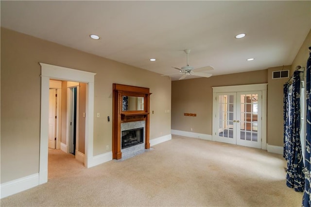 603 N 5th St, Atchison, KS 66002 - unfurnished living room featuring french doors, a fireplace, light colored carpet, recessed lighting, and ceiling fan