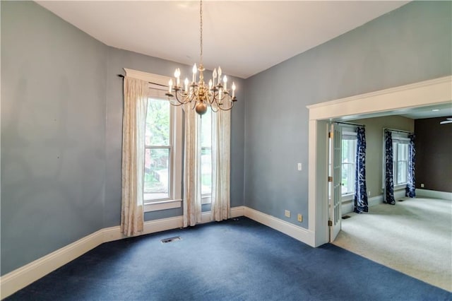 603 N 5th St, Atchison, KS 66002 - carpeted spare room with a chandelier and baseboards