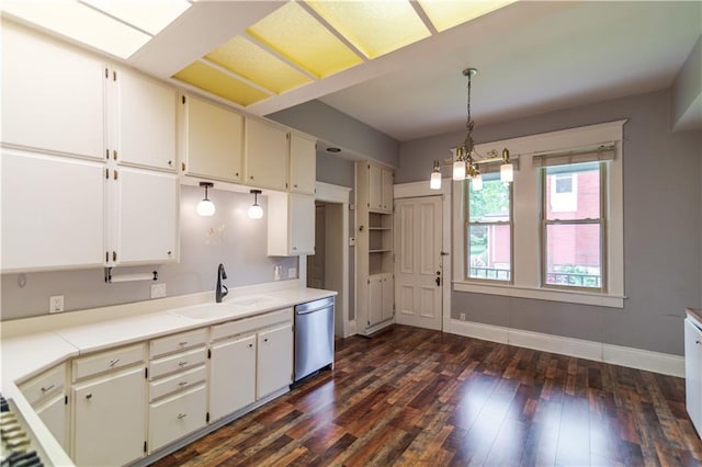 603 N 5th St, Atchison, KS 66002 - kitchen with stainless steel dishwasher, a sink, dark wood-style flooring, hanging light fixtures, and a chandelier