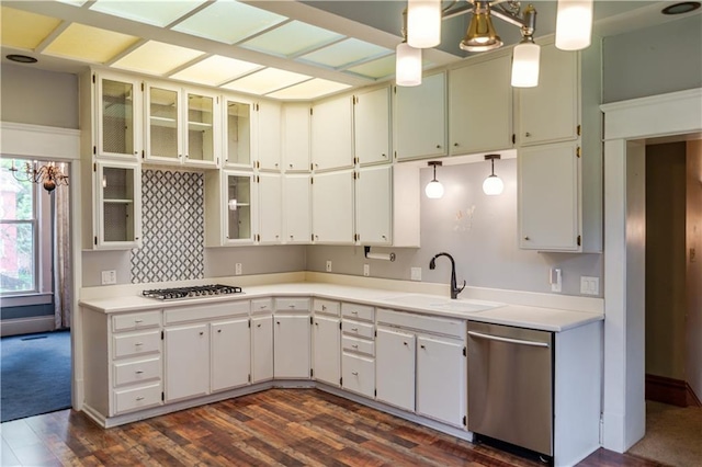 603 N 5th St, Atchison, KS 66002 - kitchen with appliances with stainless steel finishes, a sink, dark wood-style floors, light countertops, and glass insert cabinets