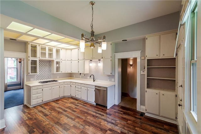 603 N 5th St, Atchison, KS 66002 - kitchen with stainless steel dishwasher, a sink, a chandelier, dark wood-style floors, and light countertops