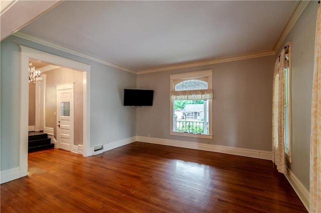 603 N 5th St, Atchison, KS 66002 - empty room with a chandelier, wood finished floors, crown molding, stairs, and baseboards