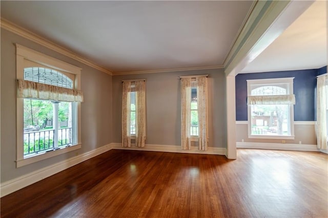 603 N 5th St, Atchison, KS 66002 - spare room featuring wood finished floors, plenty of natural light, baseboards, and ornamental molding