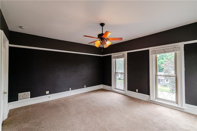 603 N 5th St, Atchison, KS 66002 - carpeted empty room featuring baseboards and a ceiling fan