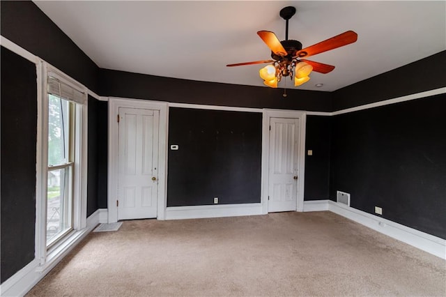 603 N 5th St, Atchison, KS 66002 - spare room with carpet flooring, a ceiling fan, and baseboards