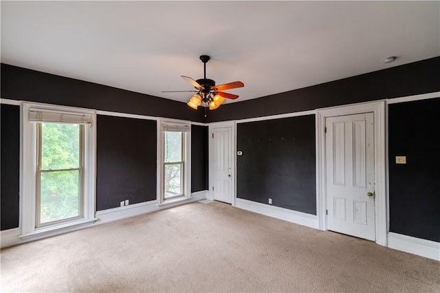 603 N 5th St, Atchison, KS 66002 - unfurnished bedroom with carpet flooring, baseboards, and two closets