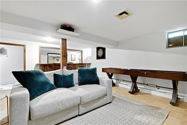 tiled living area featuring indoor bar and visible vents