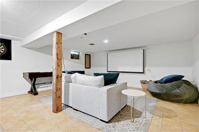 living area featuring baseboards, recessed lighting, a textured ceiling, and visible vents