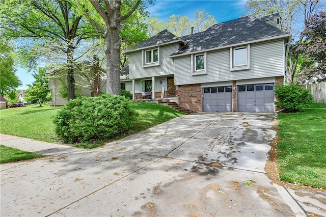 view of front of home with a garage, brick siding, fence, a front lawn, and concrete driveway
