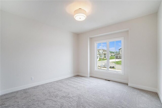 2315 SW Serena Pl, Lees Summit, MO 64082 - carpeted spare room featuring baseboards