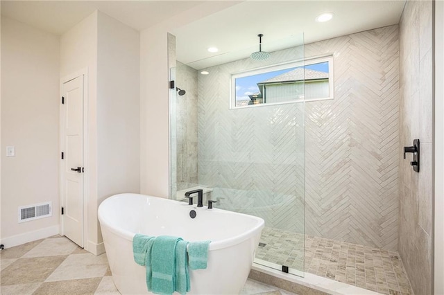 2315 SW Serena Pl, Lees Summit, MO 64082 - full bath featuring a freestanding tub, tiled shower, and recessed lighting