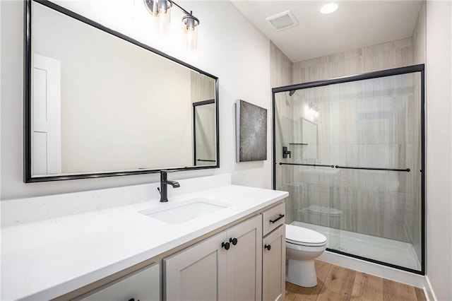 2315 SW Serena Pl, Lees Summit, MO 64082 - bathroom with vanity, a stall shower, wood finished floors, and recessed lighting