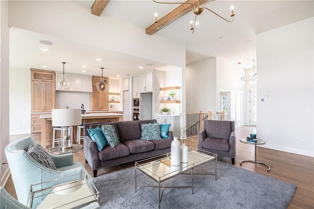 2315 SW Serena Pl, Lees Summit, MO 64082 - living area with wood finished floors, beamed ceiling, a chandelier, and recessed lighting