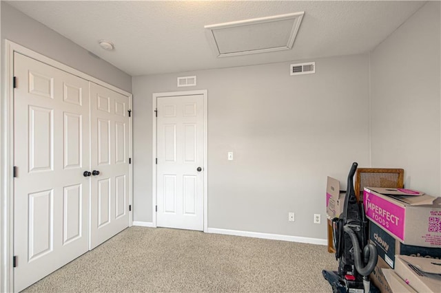 5600 NE 80th Ter Unit 3D, Kansas City, MO 64119 - interior space with attic access, carpet, and baseboards