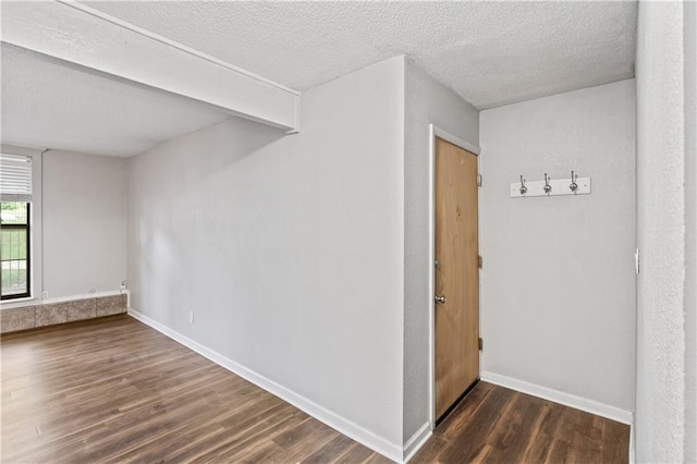4727 Jarboe St Unit 52, Kansas City, MO 64112 - spare room featuring wood finished floors, a textured ceiling, and baseboards
