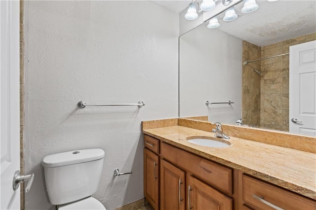 4727 Jarboe St Unit 52, Kansas City, MO 64112 - bathroom with vanity, toilet, a shower, and a textured ceiling