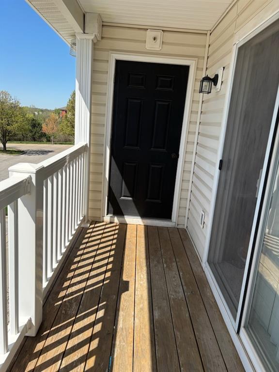 entrance to property featuring a balcony