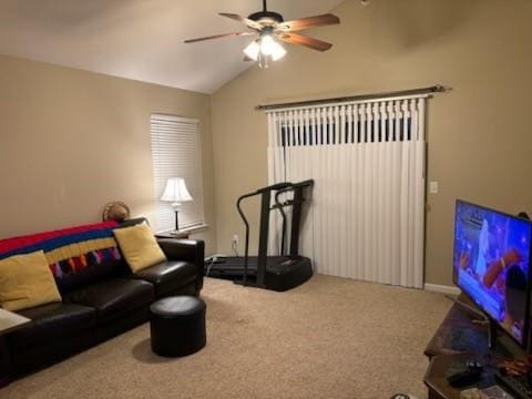 carpeted living room with lofted ceiling, a ceiling fan, and radiator heating unit