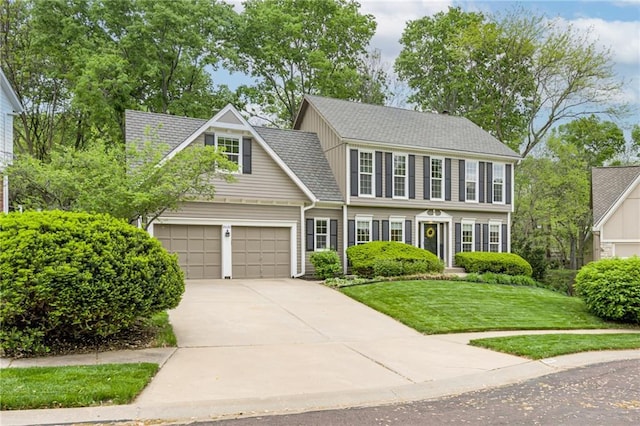 view of front facade with an attached garage, a shingled roof, driveway, and a front yard