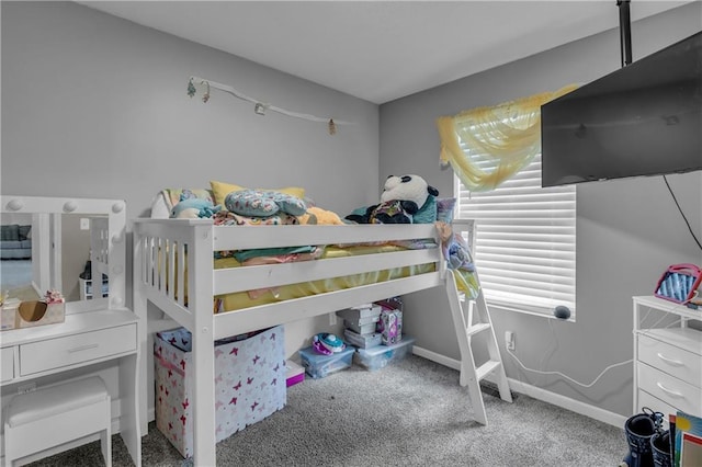 carpeted bedroom with baseboards