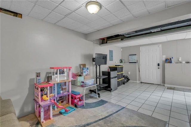 game room featuring electric panel, tile patterned floors, and baseboards