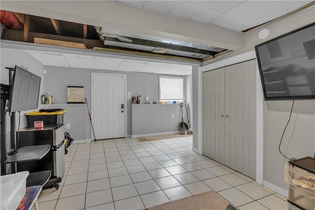 foyer entrance with baseboards and light tile patterned flooring