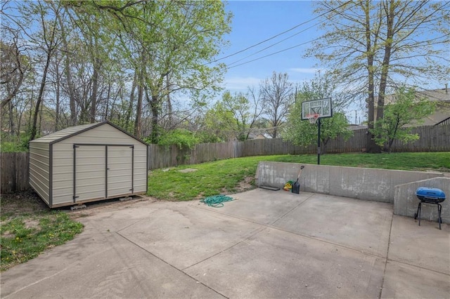 view of patio featuring a fenced backyard, a storage unit, and an outdoor structure