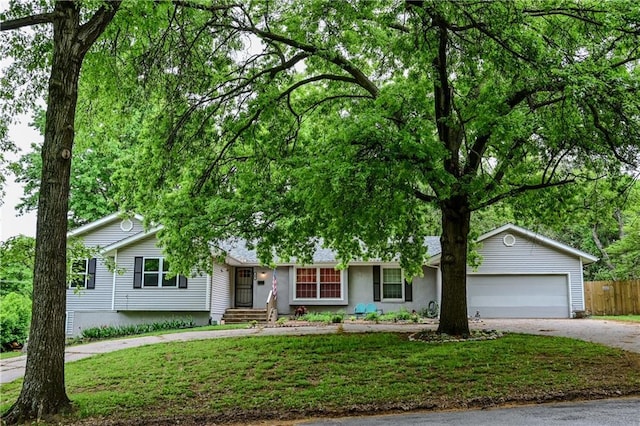 101 W Minor Dr, Kansas City, MO 64114 - ranch-style house featuring concrete driveway and an attached garage