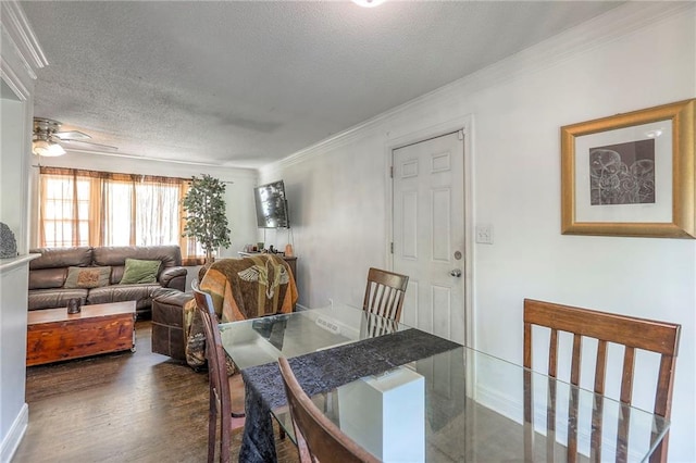 6606 E 135th St, Grandview, MO 64030 - dining room with a textured ceiling, crown molding, wood finished floors, a ceiling fan, and baseboards