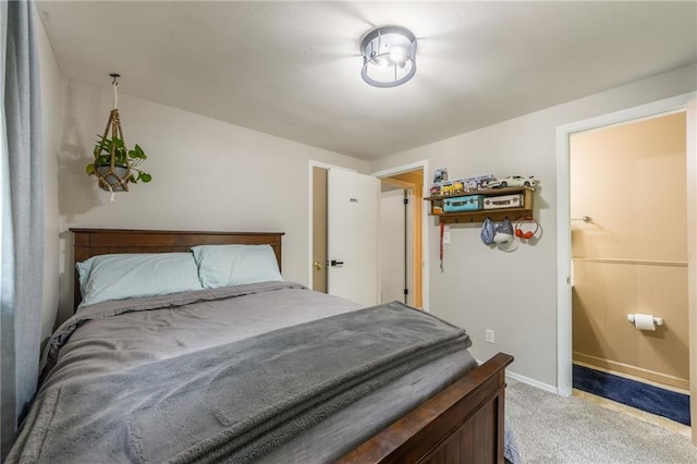 bedroom featuring baseboards and light carpet