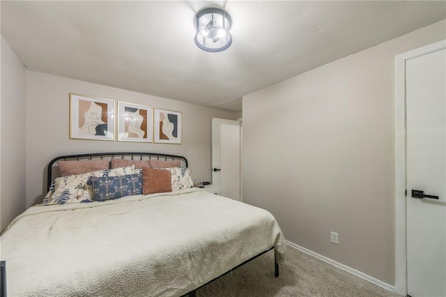 bedroom featuring carpet flooring and baseboards